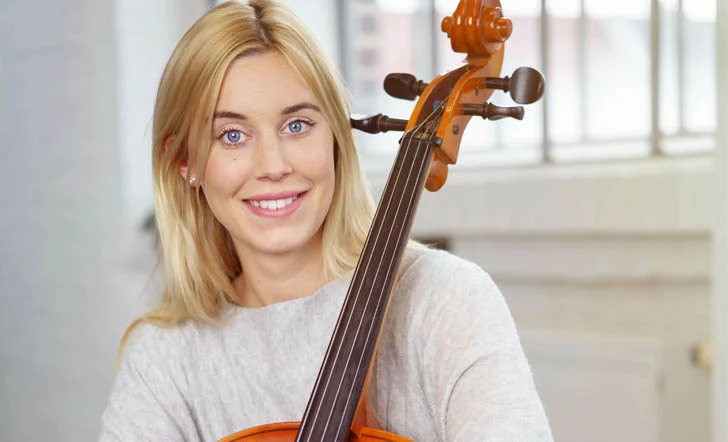 Girl student holding a Cello