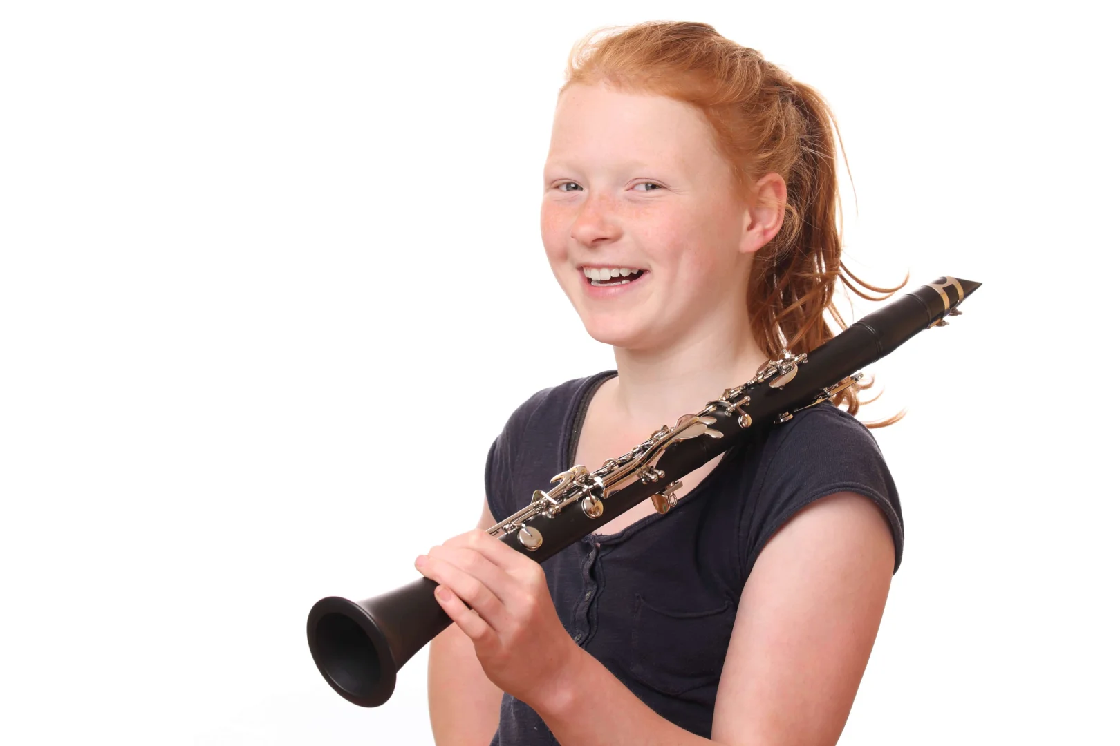 Student smiling while playing Clarinet