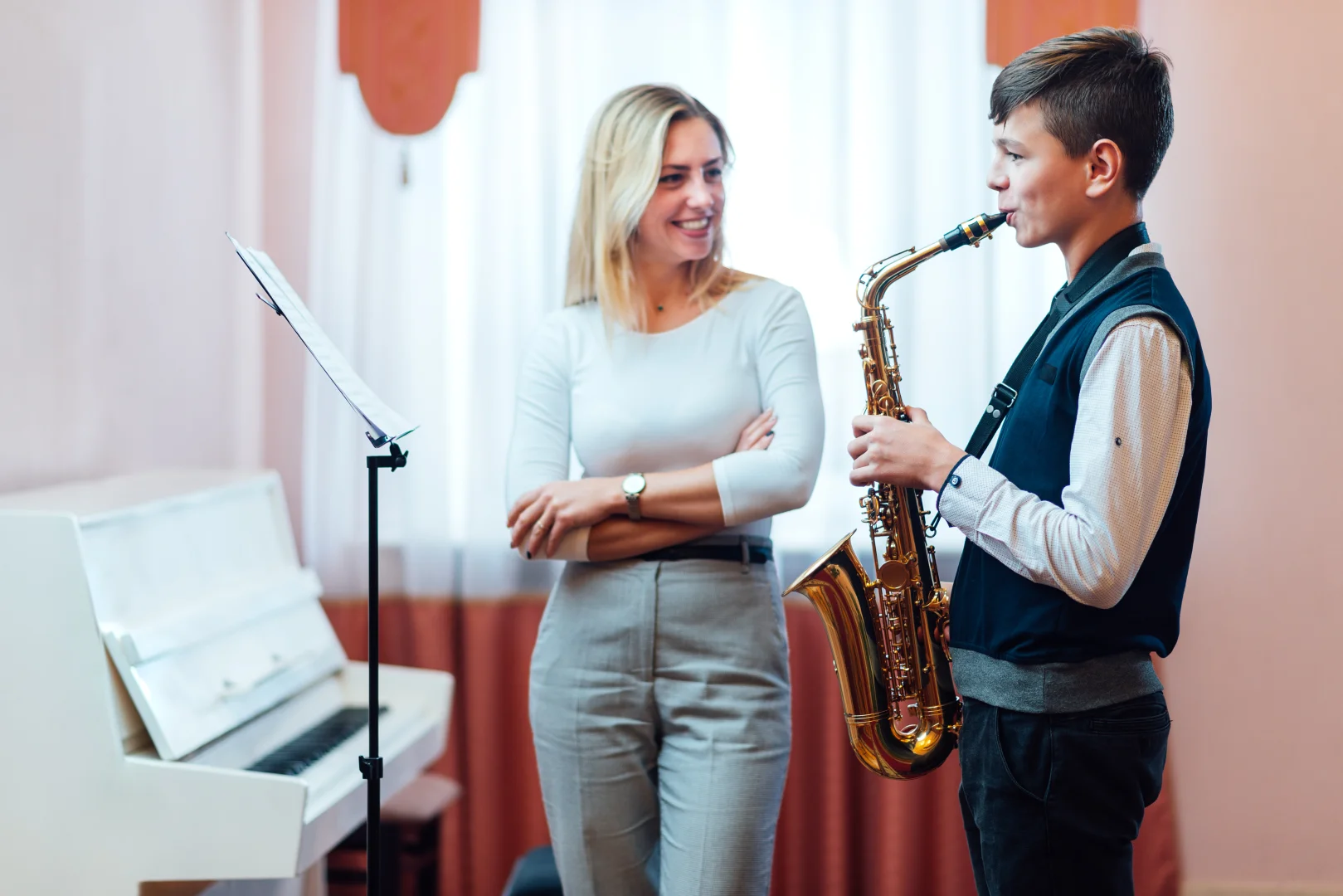 Instructor teaching her student Saxophone lessons