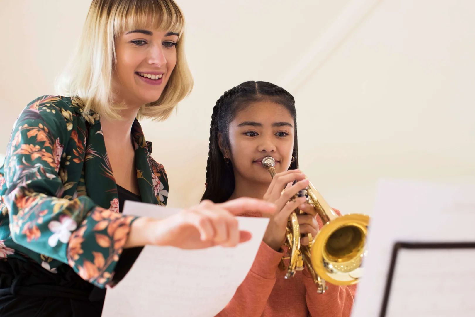 Instructor teaching her student Trumpet lessons